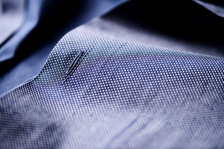 close up of a blue silk shirt with a zipper, macro shotの写真素材