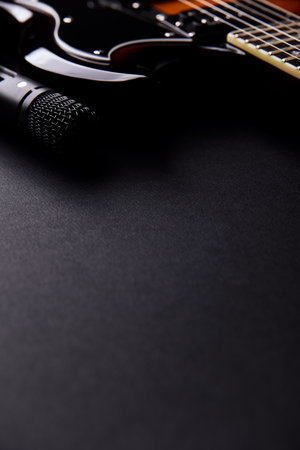 guitar and microphone on a black background, close-upの写真素材