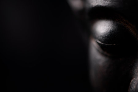 Close up of the face of a man with a black background.の写真素材