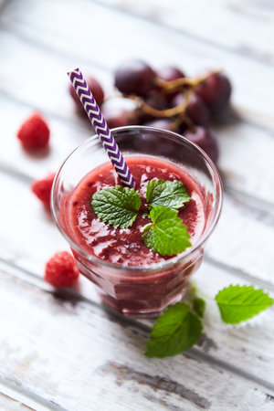 Fruit smoothie with raspberries and blueberries, selective focusの写真素材