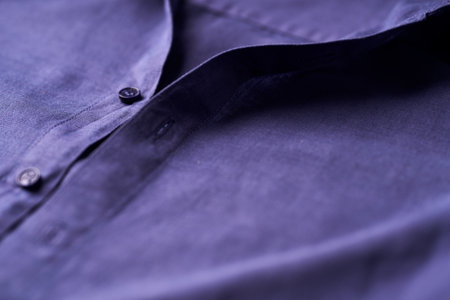 close up of a man's shirt with buttons in purple color.の写真素材