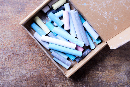 Colorful chalks in box on rustic background, closeupの写真素材