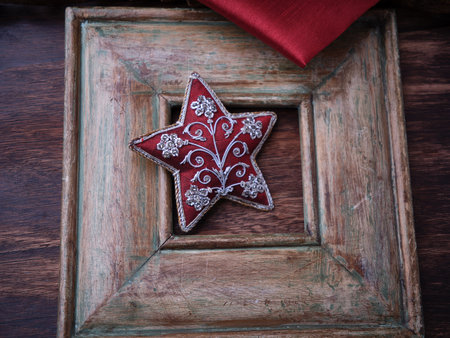 Christmas star on wooden background with red ribbon, Christmas decorationの写真素材