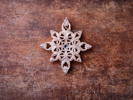 Christmas snowflake on wooden background. Top view with copy space.の写真素材
