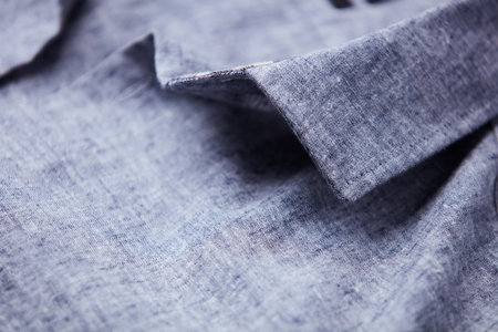 Close up of blue jeans fabric texture background. Selective focus.