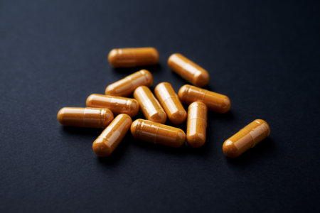 Close up of a heap of pills on black background. Focus on foreground, soft bokeh.の写真素材
