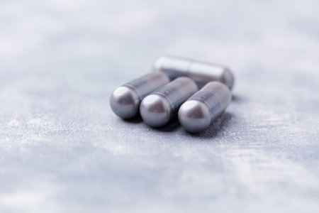Close up of pills on gray background. Focus on foreground, shallow depth of field.の写真素材