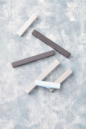 Colorful chalk on a concrete background. Top view. Copyspace.の写真素材
