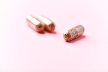 Pair of bullets on pink background. Focus on first bullet.