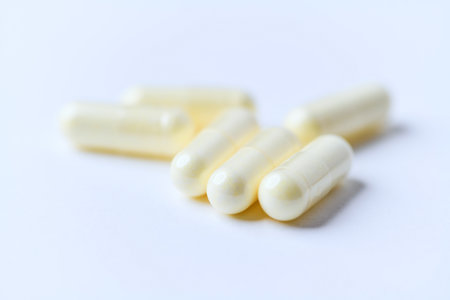 Capsules of white color on white background. Close-up.の写真素材