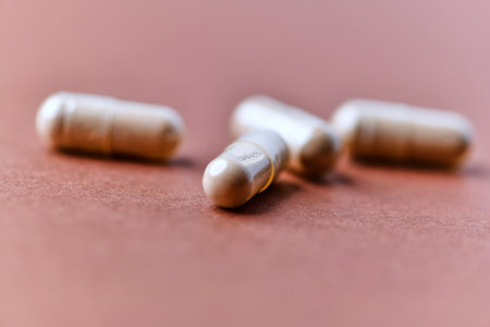 Capsules of pills on a brown background. Close upの写真素材