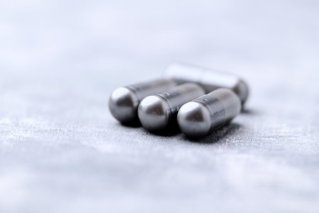 Capsules on a gray background. Selective focus. Shallow depth of field.の写真素材