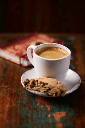 Cup of coffee with cookies on old wooden background. Selective focus.の写真素材