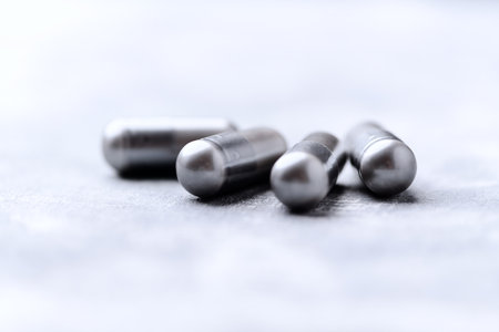 Close-up of a group of pills on a gray background.の写真素材
