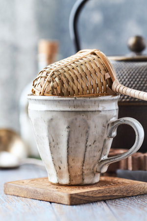 Coffee in a white cup on a wooden background, selective focus.
