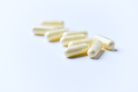 Capsules of medicine on a white background close-up.