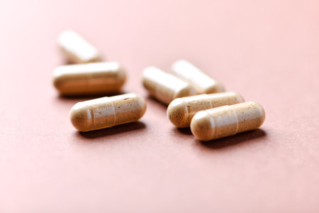 Capsules of medicine on a pink background. Close-up.の写真素材