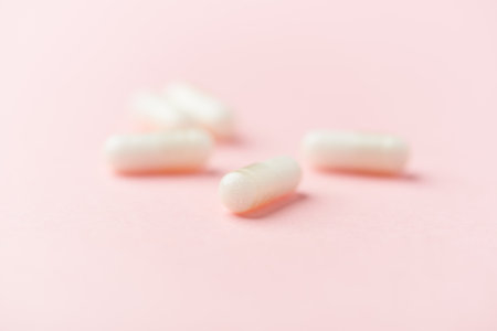 White marshmallows on a pink pastel background. Minimal concept.