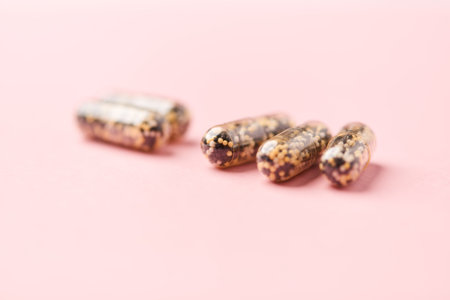 Close up of capsules of quinoa on pink background. Healthy food concept.の写真素材