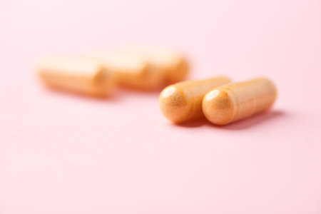 Pills on pink background, closeup. Health care and medicineの写真素材