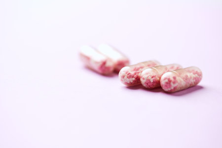 Pink pills on a pink background. Shallow depth of field.の写真素材
