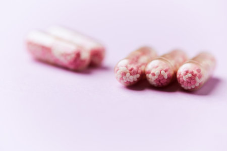 Capsules of pills on a pink background. Copyspace.の写真素材