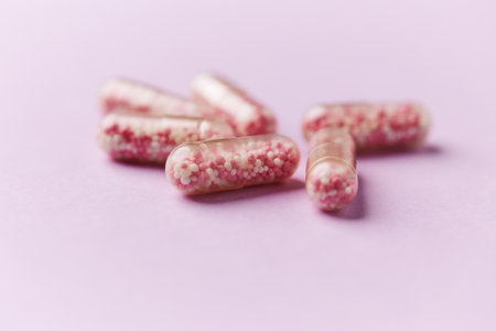 pills on a pink background. close-up. selective focus
