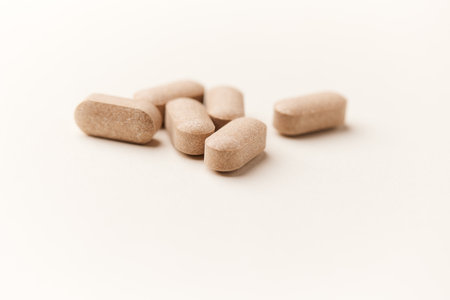 Pills on a white background. Shallow depth of field. Toned.