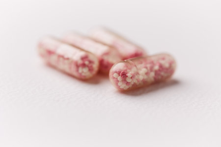 Close up of pills on white background. Focus on foreground, soft bokeh.の写真素材