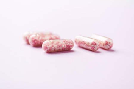 Close up of pills on pink background. Focus on foreground, soft bokeh.の写真素材