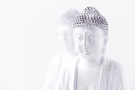 Buddha statue on white background with copy space for text.の写真素材