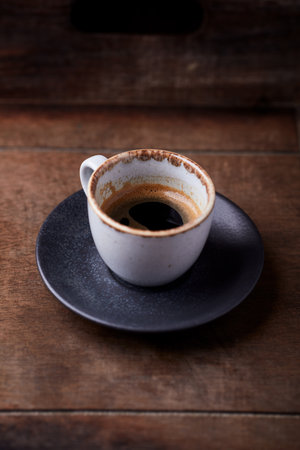 Coffee cup on wooden table, vintage style, selective focusの写真素材