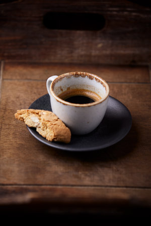 Cup of coffee and cookies on a wooden background. Toned.の写真素材