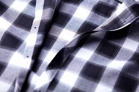 closeup of a checkered shirt with a black and white patternの写真素材