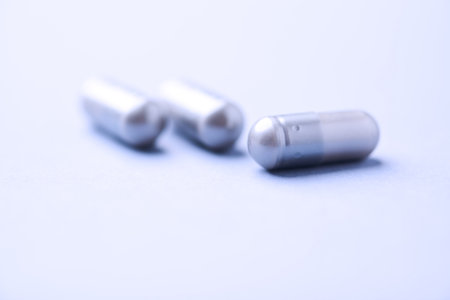 Capsules on a white background. Shallow depth of field.の写真素材