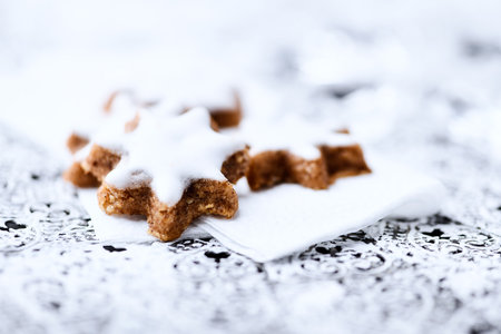 Christmas cookies with icing sugar on a napkin. Selective focus.の写真素材