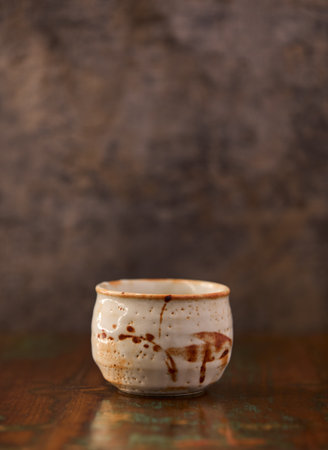 Ceramic cup on a wooden background. Selective focus.の写真素材