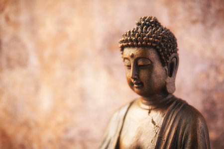 Buddha statue on grunge wall background with copy space.の写真素材