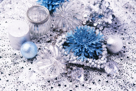 Christmas decoration with blue and silver balls, candle and snowflakesの写真素材