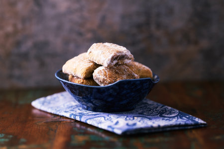 Traditional christmas cookies in a bowl on a wooden background. Soft focus.の写真素材