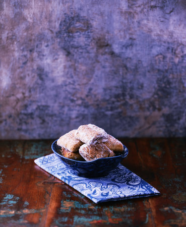 Traditional cookies in a bowl on a wooden background. Soft focus.の写真素材