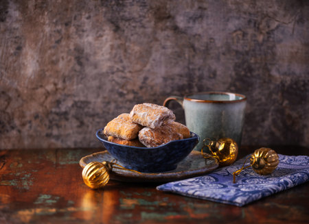 Traditional christmas cookies in a bowl on a wooden background. Soft focus.