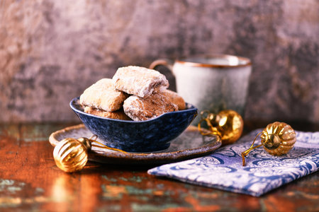 Traditional christmas cookies in a bowl on a wooden background. Soft focus.の写真素材