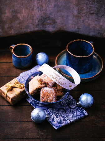 Traditional christmas cookies in on rustic wooden background. Soft focus.の写真素材