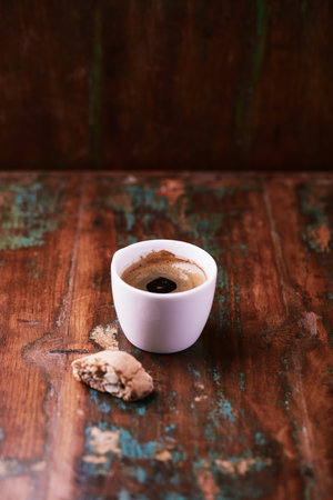 Cup of coffee on a wooden background. Selective focus.の写真素材