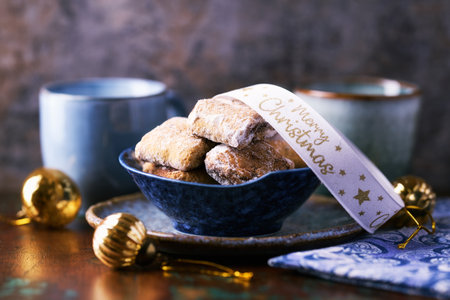 Traditional christmas cookies in a bowl on a wooden background. Selective focus.の写真素材