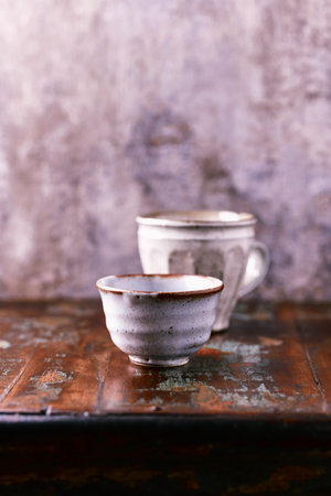 Traditional japanese ceramic on rustic wooden background. Soft focus. Copy space.の写真素材