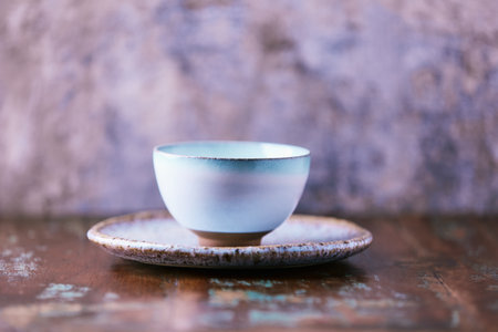 Traditional japanese ceramic on rustic wooden background. Soft focus. Copy space.の写真素材