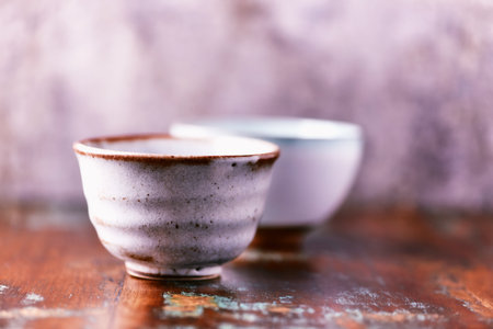 Traditional japanese ceramic on rustic wooden background. Soft focus. Copy space.の写真素材