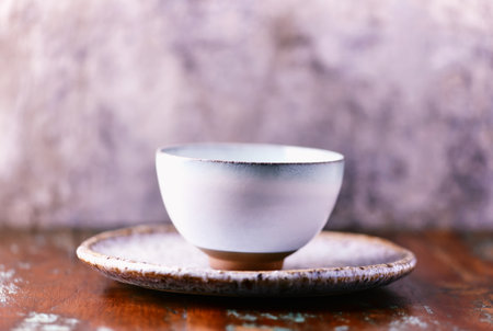 Traditional japanese ceramic on rustic wooden background. Soft focus. Copy space.の写真素材